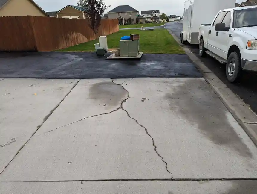 Before: a driveway in Ellensburg with open cracks running across it