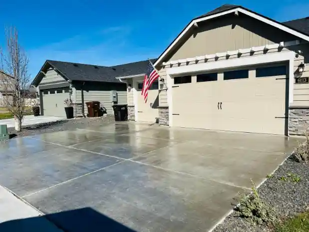 The same driveway after sealing, with the wet look of fresh sealer