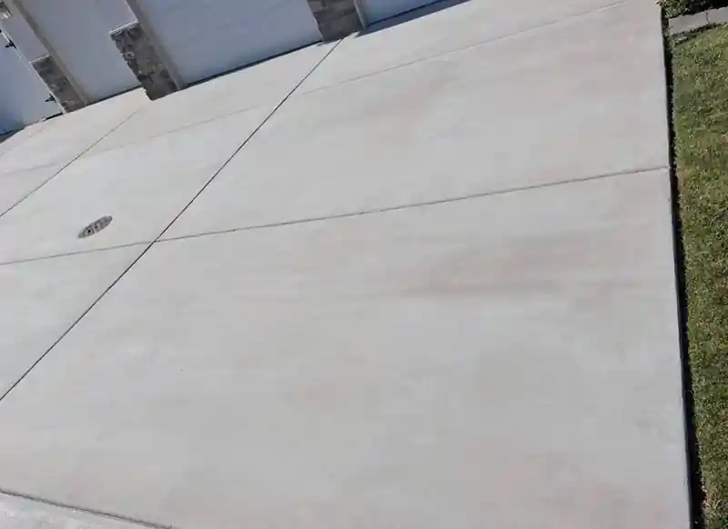 Clean driveway panels after the job, low angle along the control joints