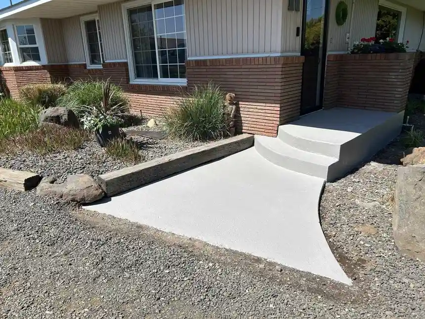 Front ramp and steps at a brick ranch house after resurfacing