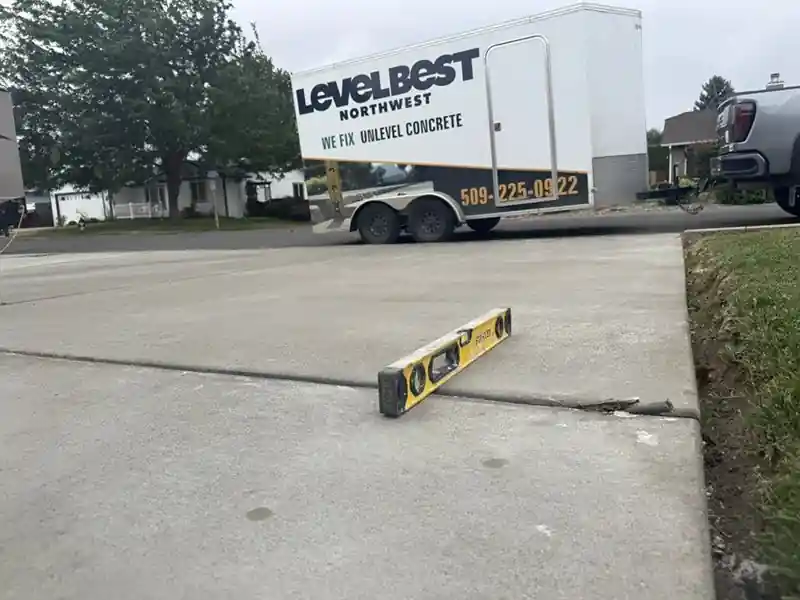 After: the same slab lifted level across the joint, no more step